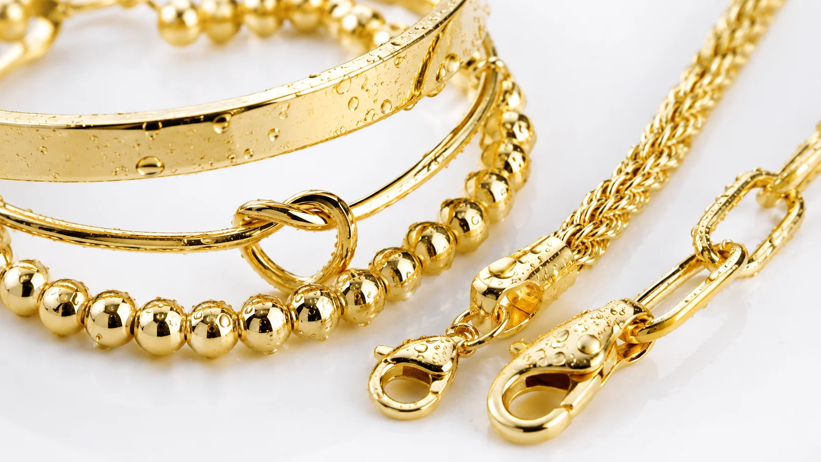 Close-up detail of non-tarnish waterproof 14K gold plated bracelets showing quality construction