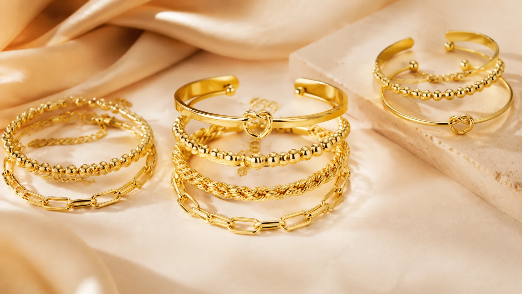 Full stackable gold bracelets set for women in lifestyle product arrangement
